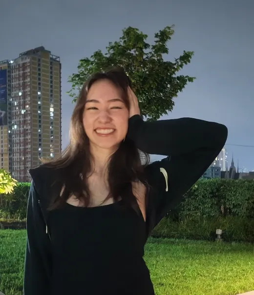 me smiling by the pool at night